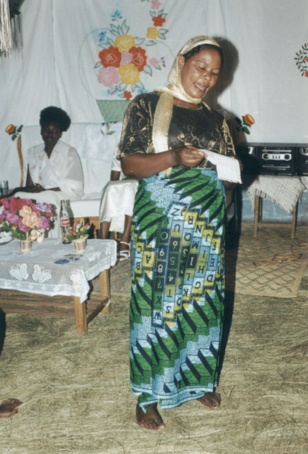 Joanitha's aunt giving a speech at the mama kikapu ceremony, Bukoba, Tanzania, 2003