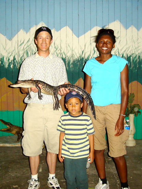Greg, Joanitha and Joachim with baby alligator, Mosca, Colorado, 2010