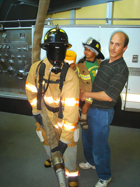 Greg and Joachim with fireman, Children's Museum, Denver, Colorado, 2007