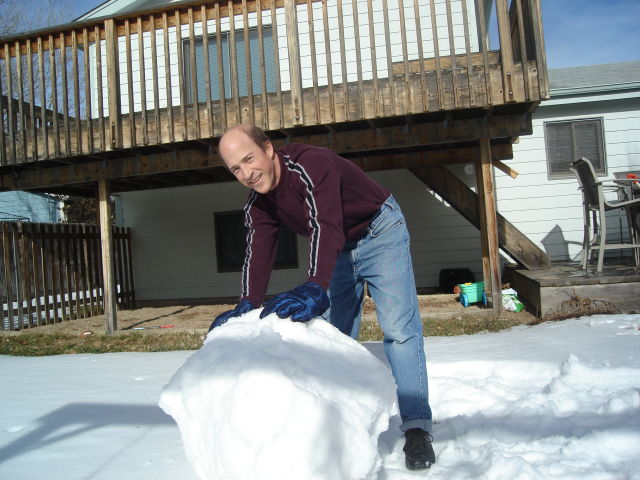 Greg building a snowman in the back yard, Fort Collins, Colorado, 2008