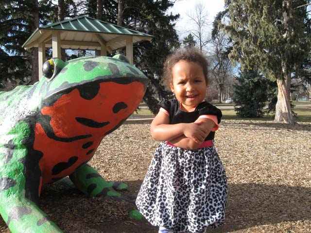 Irene by a giant frog at City Park, Fort Collins, Colorado, 2016