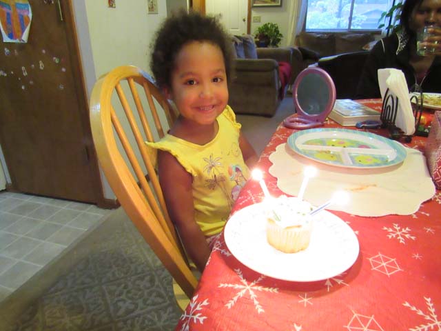Irene with birthday cake, Fort Collins, Colorado, 2017