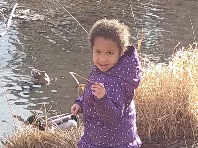Irene with ducks at Edora Park, Fort Collins, Colorado, 2018