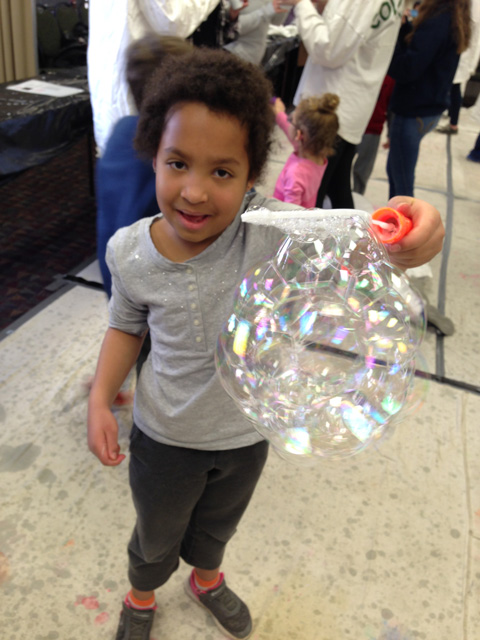 Irene holding soap bubbles at the Little Shop of Physics at CSU, Fort Collins, Colorado, 2020