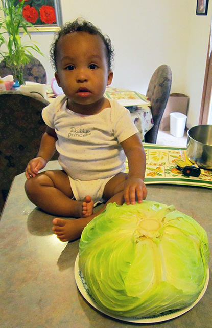 Irene with a cabbage at 11.5 months, Fort Collins, Colorado, 2014