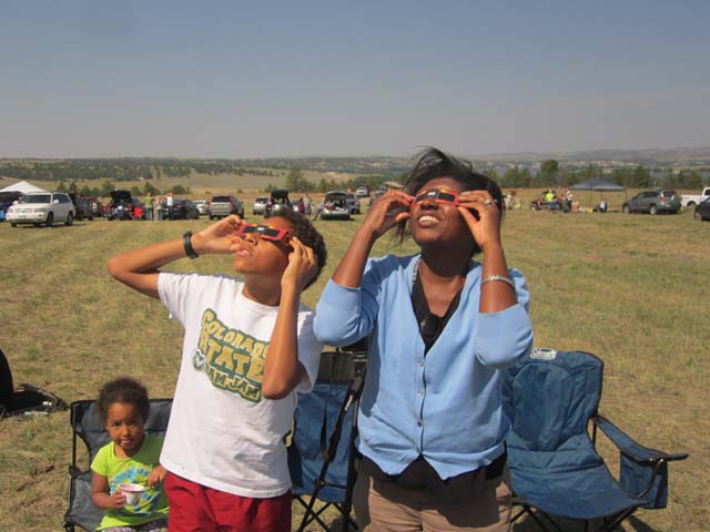 Irene, Joachim and Joanitha viewing solar eclipse, Guernsey State Park, Wyoming, 2017