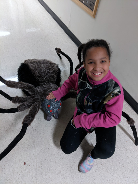 Irene with giant spider at the CSU Chemistry Spooktacular, Fort Collins, Colorado, 2022
