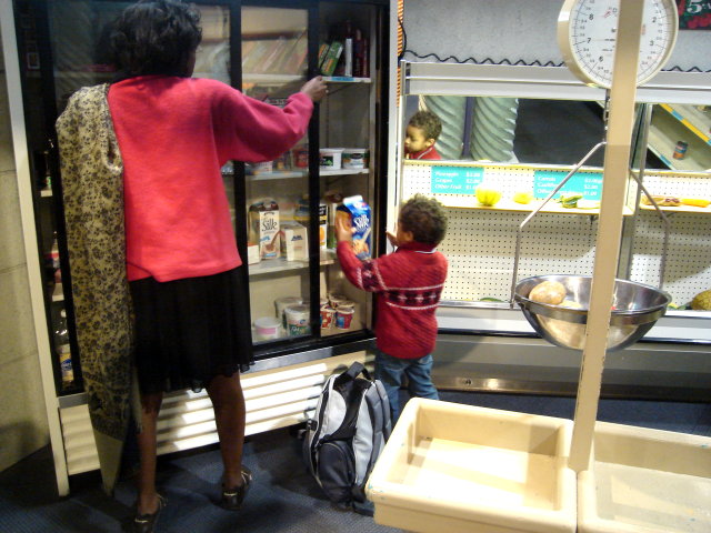 Joanitha and Joachim at a market in the children's museum, Las Vegas, Nevada, 2009