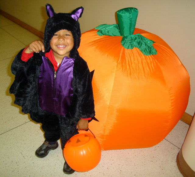 Joachim with bat costume by inflated pumpkin, Fort Collins, Colorado, 2008