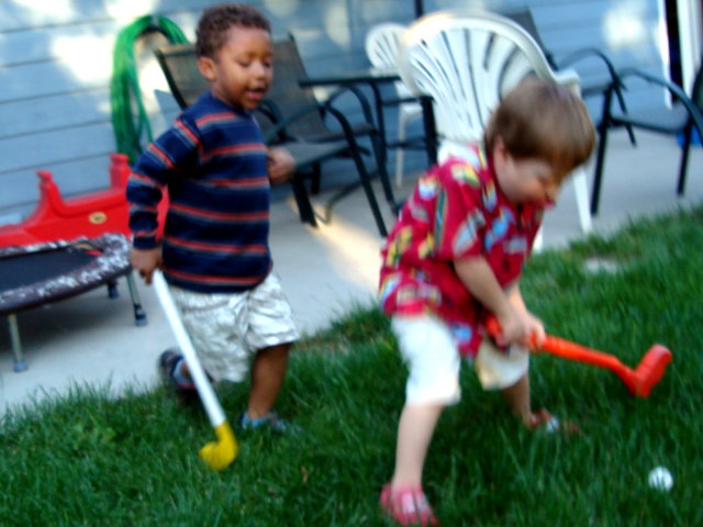 Joachim and Dylan playing golf, Fort Collins, Colorado, 2009