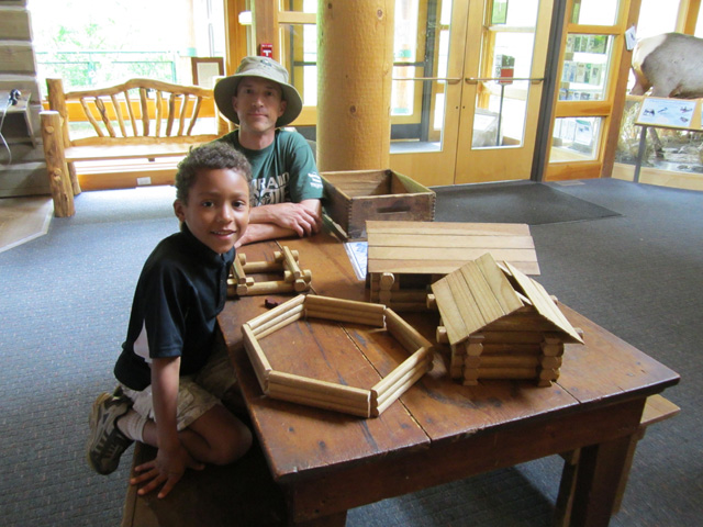 Joachim and Greg with log cabin, Golden Gate Canyon State Park, Colorado, 2011