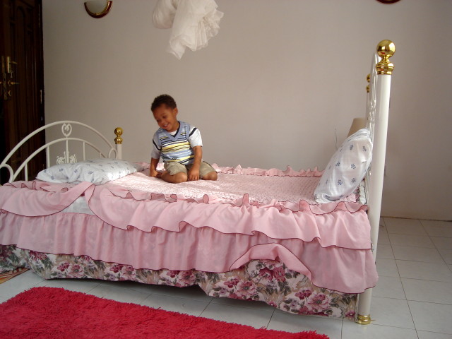 Joachim on a bed, Arusha, Tanzania, 2008