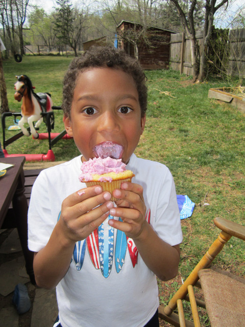 Joachim eating a pink cupcake, Fort Collins, Colorado, 2012