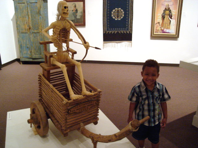 Joachim with a skeleton in a museum, Albuquerque, New Mexico, 2009