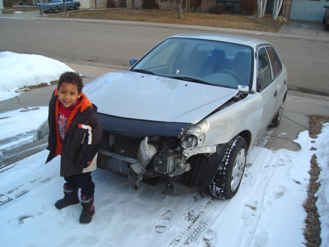 Joachim with totalled Toyota, Fort Collins, Colorado, 2010