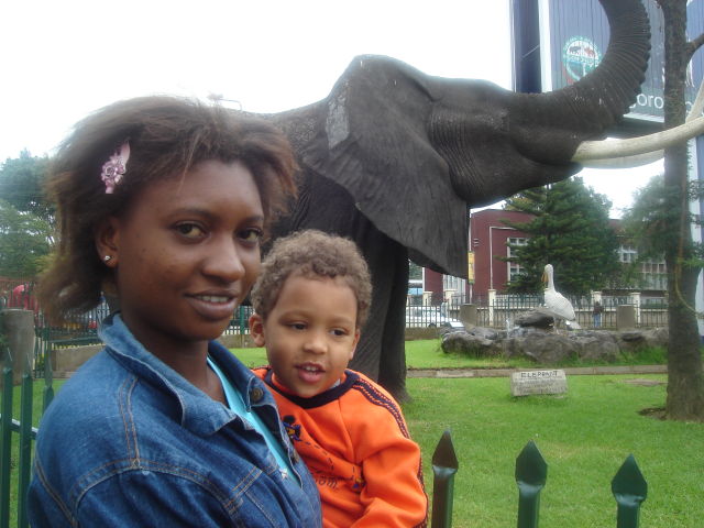 Maria and Joachim with elephant statue, Arusha, Tanzania, 2008