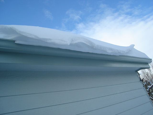 snow hanging from a gutter, Fort Collins, Colorado, 2006
