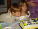 Dylan and Cassie with first communion cake, Fort Collins, Colorado, 2011