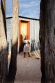 child outside a tin house, Oniipa, Namibia, 1995