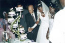 Greg and Joanitha cutting the wedding cake, Bukoba, Tanzania, 2003