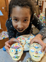 Irene with Dia de las Muertas cookies she decorated, Fort Collins, Colorado, 2022