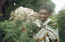 Joanitha with flowers, Mount Elgon, Uganda, 2003