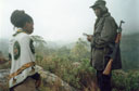 Joanitha with armed park ranger, Mount Elgon, Uganda, 2003