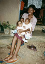 Joanitha holding triplets, Bukoba, Tanzania, 1997