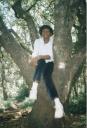 Joanitha in a tree, national arboretum, Nairobi, Kenya, 2003
