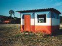 Red, white and blue tin house, Ohangwena, Namibia, 1997